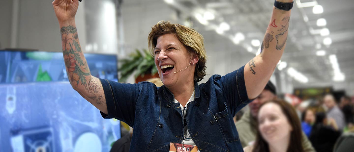 Visitors enjoying gourmet food and fine wines at Sun Wine & Food Fest 2024 in Uncasville, CT, featuring celebrity chefs, wine tastings, and culinary demonstrations.